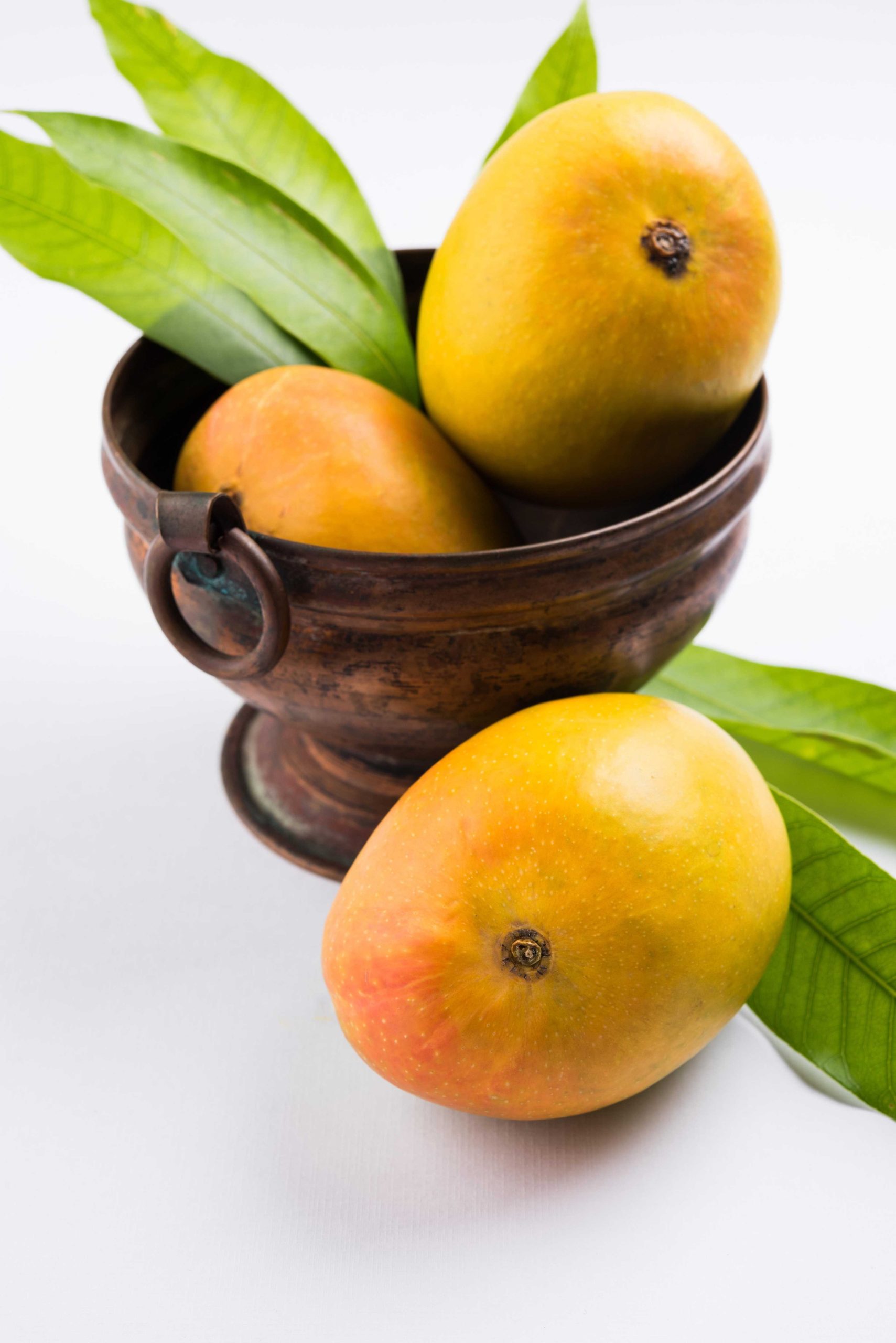 alphonso-mango-hapoos-aam-is-seasonal-juicy-fruit-from-india-known-it-s-sweetness-richness-flavour-colourful-background-selective-focus_(2)-transformed