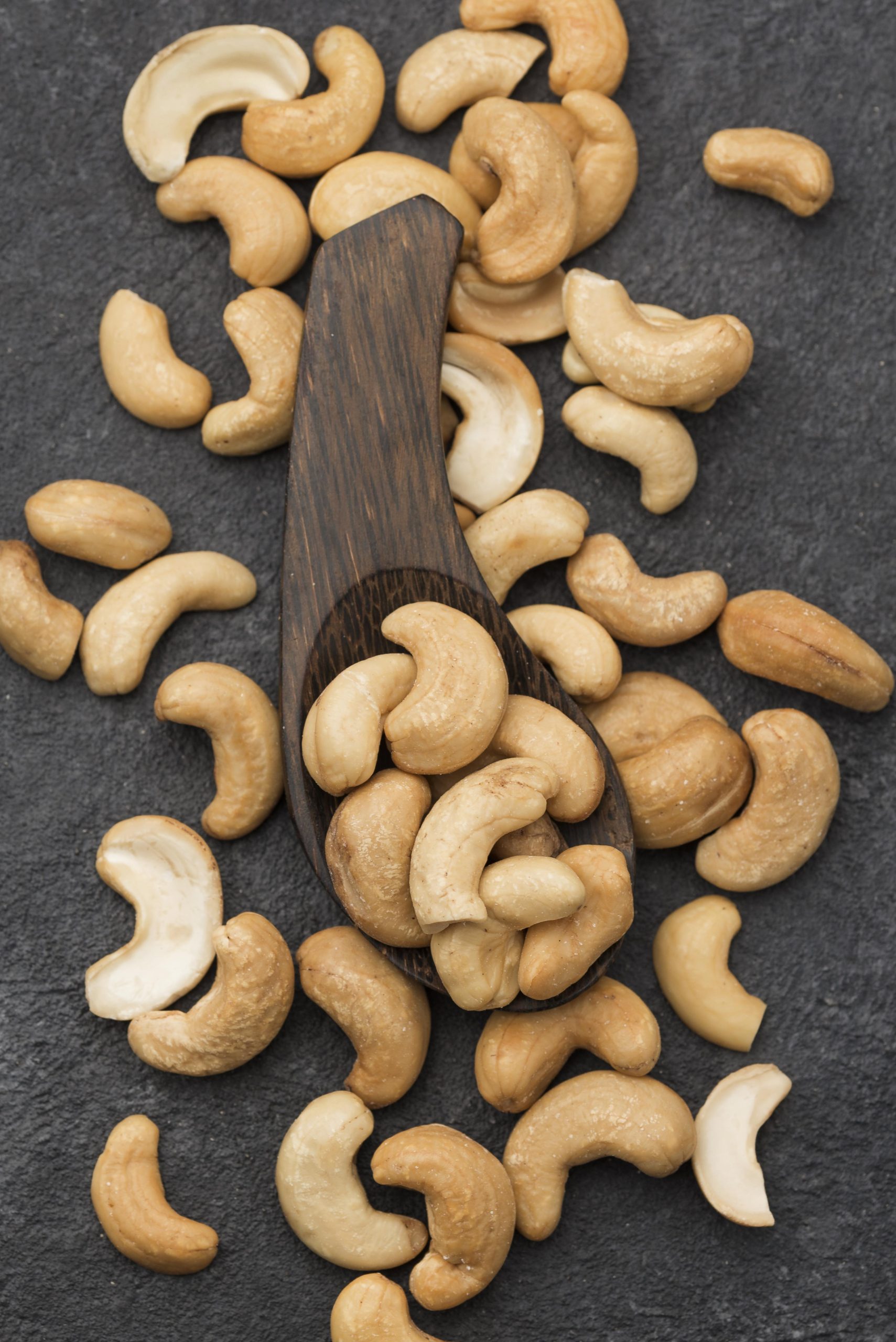 healthy-raw-cashew-nuts-big-wooden-spoon