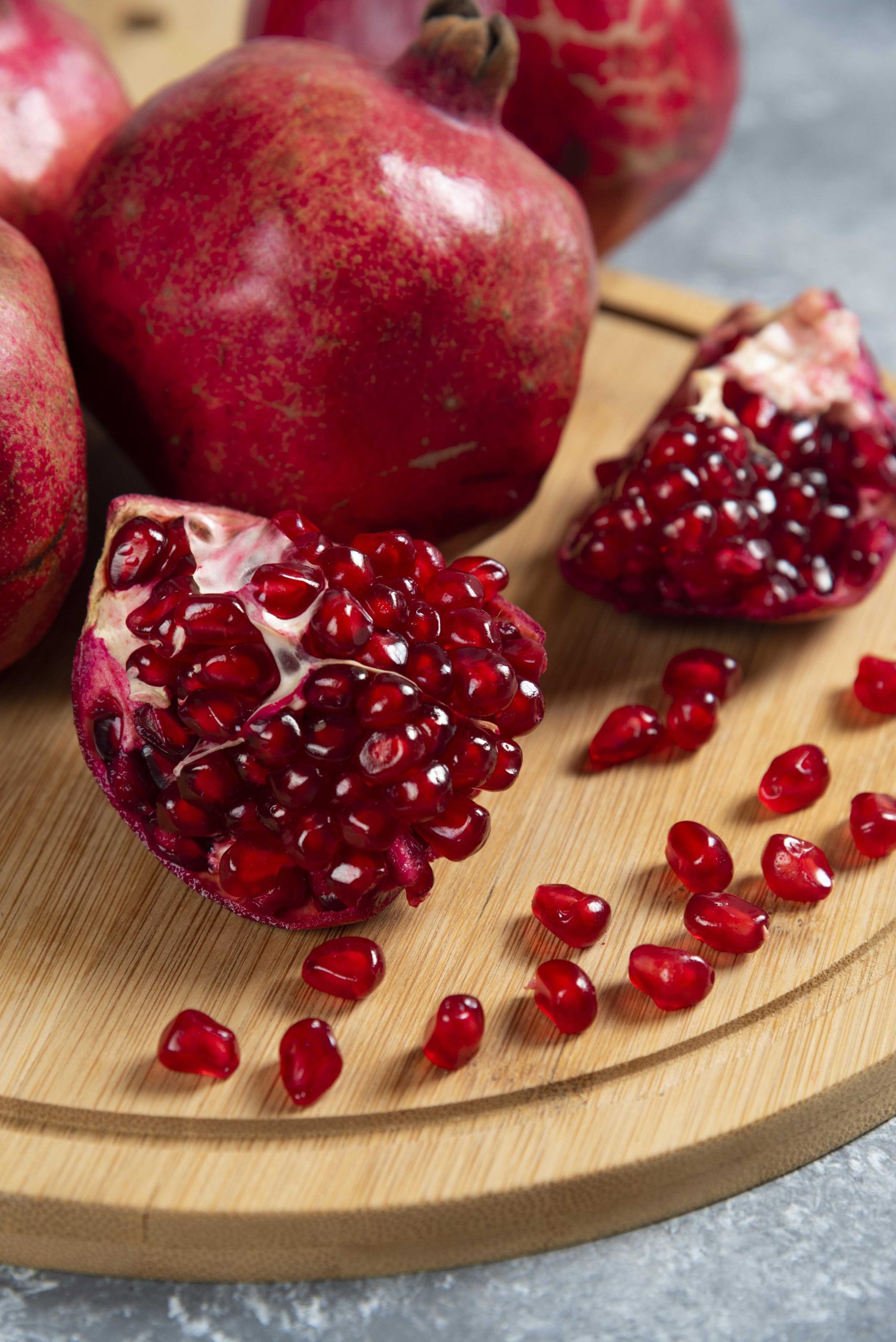 sliced-ripe-pomegranate-wooden-board-transformed